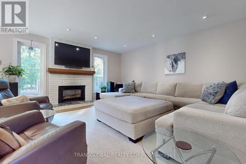 1813 St. Johns Road, Innisfil, ON - Indoor Photo Showing Living Room With Fireplace