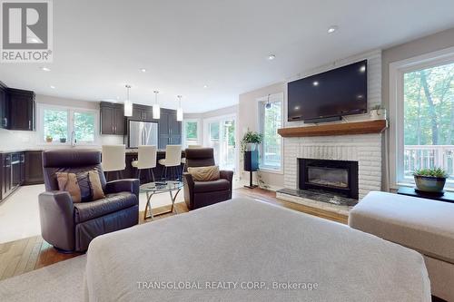 1813 St. Johns Road, Innisfil, ON - Indoor Photo Showing Living Room With Fireplace