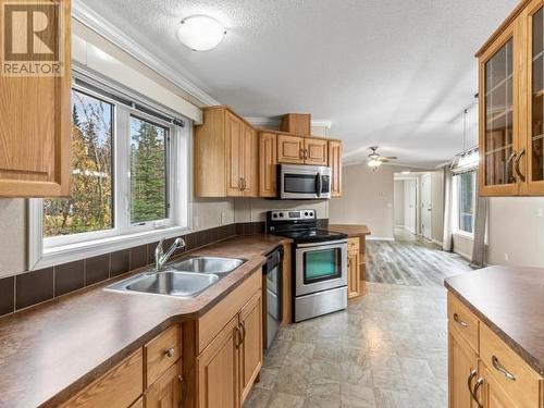 24 Sawmill Road, Teslin, YT - Indoor Photo Showing Kitchen With Double Sink