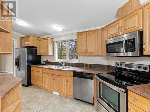 24 Sawmill Road, Teslin, YT - Indoor Photo Showing Kitchen With Double Sink