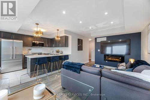 27 - 100 Dufay Road, Brampton, ON - Indoor With Fireplace