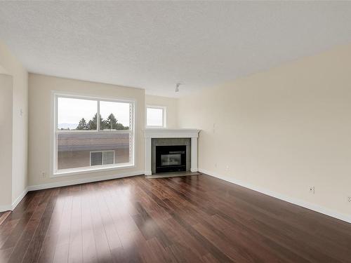 404-445 Cook St, Victoria, BC - Indoor Photo Showing Living Room With Fireplace