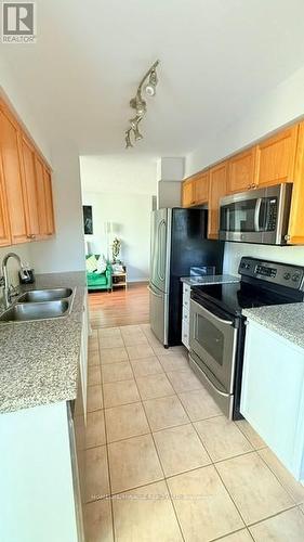 203 - 4889 Kimbermount Avenue N, Mississauga, ON - Indoor Photo Showing Kitchen With Double Sink