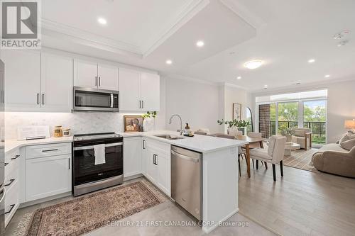 Open Concept Floorplan with tree view - 308 - 1975 Fountain Grass Drive, London, ON - Indoor Photo Showing Kitchen With Upgraded Kitchen