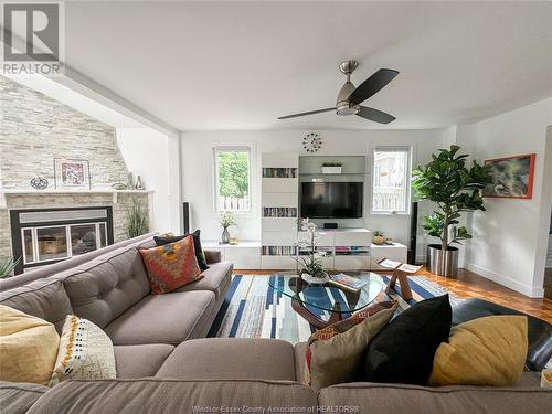 8235 Riverside Drive East, Windsor, ON - Indoor Photo Showing Living Room With Fireplace