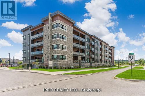 307 - 120 Summersides Boulevard, Pelham, ON - Outdoor With Balcony With Facade