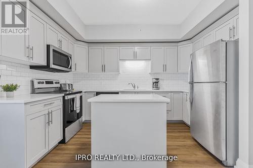 307 - 120 Summersides Boulevard, Pelham, ON - Indoor Photo Showing Kitchen With Upgraded Kitchen