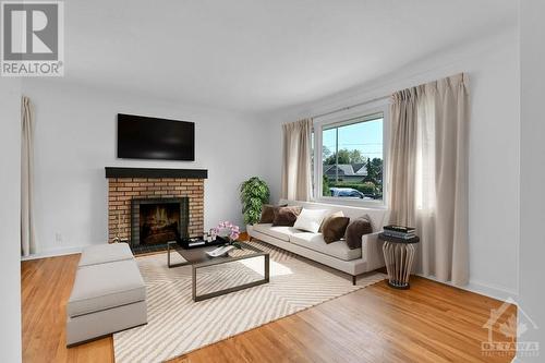 Virtually staged living room - 17 Westwood Drive, Ottawa, ON - Indoor Photo Showing Living Room With Fireplace