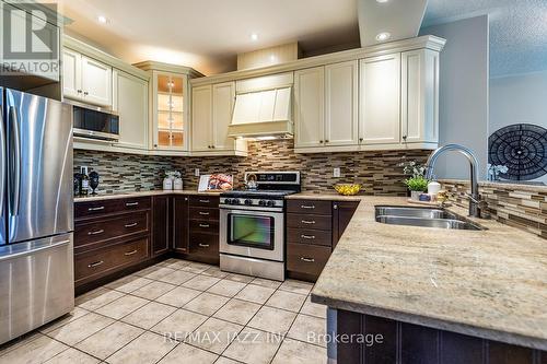 3061 Trulls Road, Clarington (Courtice), ON - Indoor Photo Showing Kitchen With Double Sink With Upgraded Kitchen