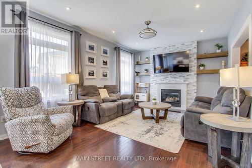 169 The Queensway, Barrie, ON - Indoor Photo Showing Living Room With Fireplace