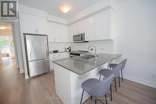 216 - 652 Cricklewood Drive, Mississauga, ON - Indoor Photo Showing Kitchen With Stainless Steel Kitchen With Double Sink With Upgraded Kitchen