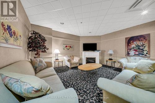 609 - 10 Dayspring Circle, Brampton, ON - Indoor Photo Showing Living Room With Fireplace