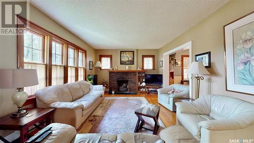 156 Connaught Crescent, Regina, SK - Indoor Photo Showing Living Room With Fireplace