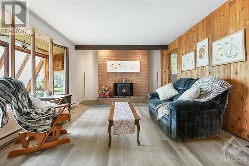 500 Ashdad Road, Renfrew, ON - Indoor Photo Showing Living Room With Fireplace