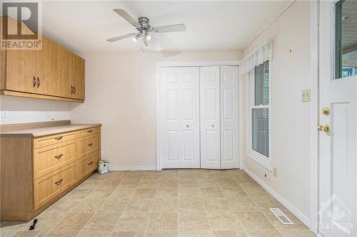 Bonus Room off the kitchen could be used as a den/dining/office  washer/dryer behind the bifold doors. - 31 Cassell Lane, Smiths Falls, ON 