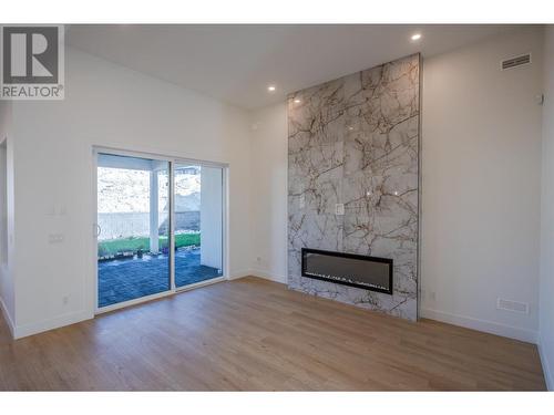 1125 Antler Drive, Penticton, BC - Indoor Photo Showing Living Room With Fireplace