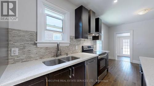 86 Bloor Street W, Oshawa, ON - Indoor Photo Showing Kitchen With Double Sink With Upgraded Kitchen