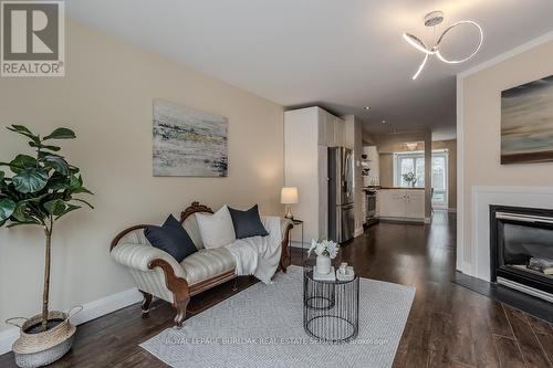 605 - 895 Maple Avenue, Burlington, ON - Indoor Photo Showing Living Room With Fireplace