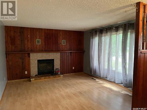 65 Bellamy Avenue, Birch Hills, SK - Indoor Photo Showing Living Room With Fireplace