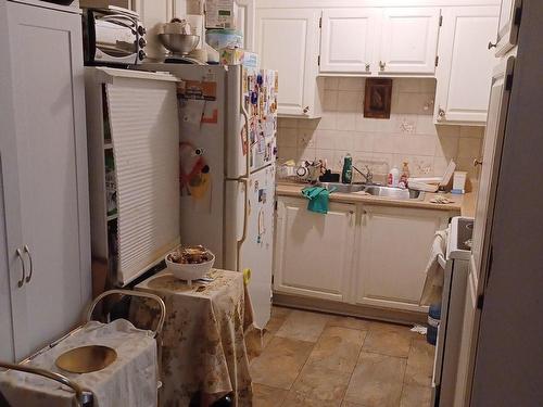 Cuisine - 218-5210 Rue Riviera, Montréal (Pierrefonds-Roxboro), QC - Indoor Photo Showing Laundry Room