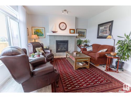 17115 46 St Nw, Edmonton, AB - Indoor Photo Showing Living Room With Fireplace