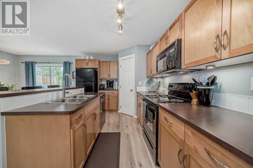 205 Country Village Manor Ne, Calgary, AB - Indoor Photo Showing Kitchen With Double Sink