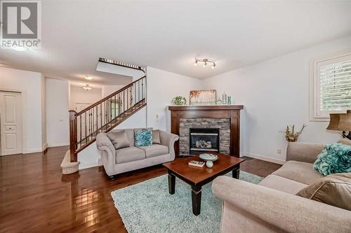 11 Crestridge Way Sw, Calgary, AB - Indoor Photo Showing Living Room With Fireplace