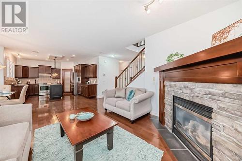 11 Crestridge Way Sw, Calgary, AB - Indoor Photo Showing Living Room With Fireplace