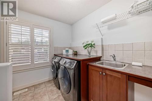 11 Crestridge Way Sw, Calgary, AB - Indoor Photo Showing Laundry Room