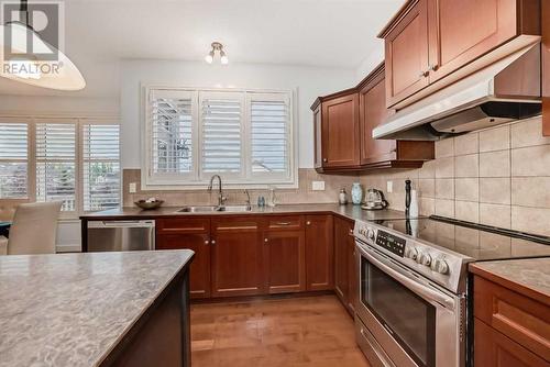 11 Crestridge Way Sw, Calgary, AB - Indoor Photo Showing Kitchen With Double Sink