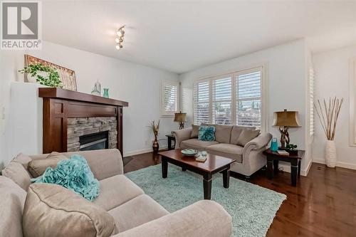 11 Crestridge Way Sw, Calgary, AB - Indoor Photo Showing Living Room With Fireplace