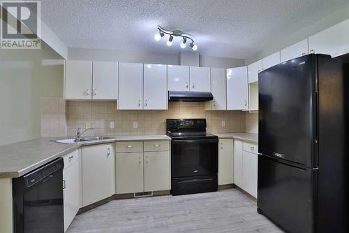 212 Scenic Acres Terrace Nw, Calgary, AB - Indoor Photo Showing Kitchen With Double Sink