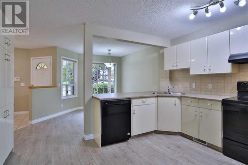 212 Scenic Acres Terrace Nw, Calgary, AB - Indoor Photo Showing Kitchen With Double Sink