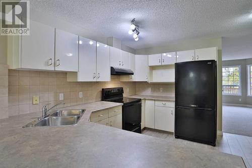 212 Scenic Acres Terrace Nw, Calgary, AB - Indoor Photo Showing Kitchen With Double Sink