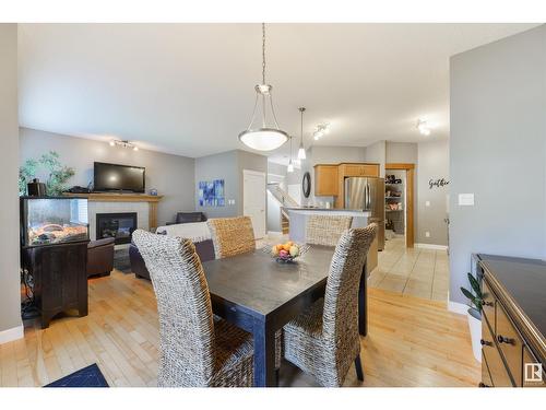 21906 94A Av Nw, Edmonton, AB - Indoor Photo Showing Dining Room With Fireplace