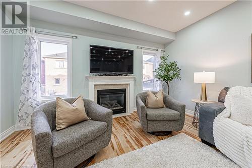 4264 Vivaldi Road E, Burlington, ON - Indoor Photo Showing Living Room With Fireplace