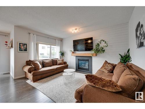 7819 173 Av Nw, Edmonton, AB - Indoor Photo Showing Living Room With Fireplace