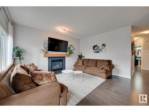 7819 173 Av Nw, Edmonton, AB - Indoor Photo Showing Living Room With Fireplace