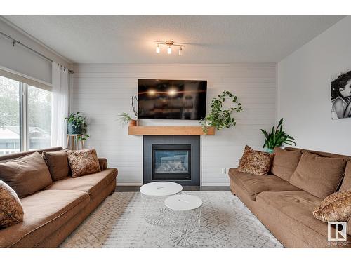 7819 173 Av Nw, Edmonton, AB - Indoor Photo Showing Living Room With Fireplace