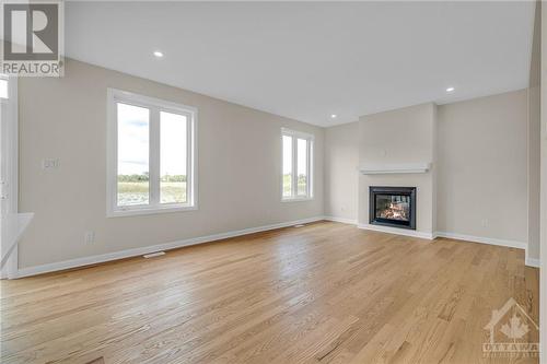 201 Elsie Macgill Walk, Ottawa, ON - Indoor Photo Showing Living Room With Fireplace