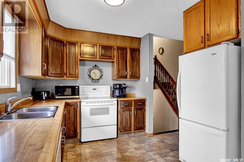 7312 1St Avenue N, Regina, SK - Indoor Photo Showing Kitchen With Double Sink