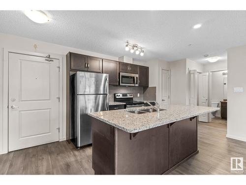 #106 7711 71 St Nw, Edmonton, AB - Indoor Photo Showing Kitchen With Stainless Steel Kitchen With Double Sink