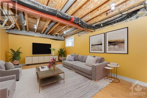 Lower level family room; this photo has been digitally staged - 507 Cherokee Way, Stittsville, ON - Indoor Photo Showing Basement