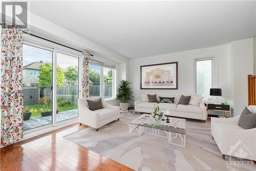 Living room; this photo has been digitally staged - 507 Cherokee Way, Stittsville, ON - Indoor Photo Showing Living Room