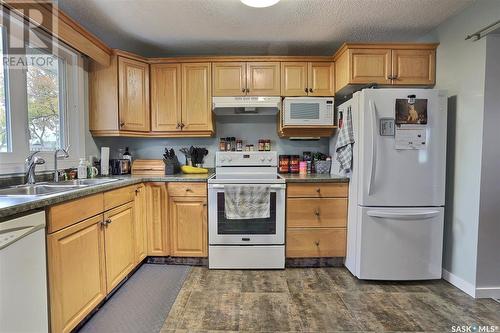 74 Weekes Crescent, Regina, SK - Indoor Photo Showing Kitchen With Double Sink