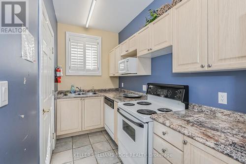 301 - 1441 Walker'S Line, Burlington, ON - Indoor Photo Showing Kitchen With Double Sink