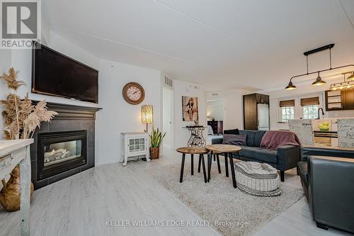 301 - 1441 Walker'S Line, Burlington, ON - Indoor Photo Showing Living Room With Fireplace