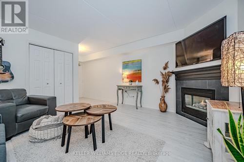 301 - 1441 Walker'S Line, Burlington, ON - Indoor Photo Showing Living Room With Fireplace