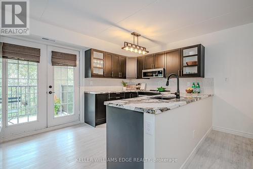 301 - 1441 Walker'S Line, Burlington, ON - Indoor Photo Showing Kitchen With Upgraded Kitchen