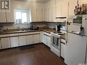 1023 J Avenue N, Saskatoon, SK  - Indoor Photo Showing Kitchen With Double Sink 